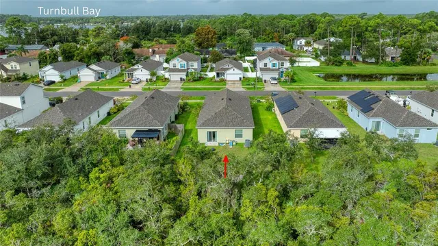 an aerial view of a house with a garden