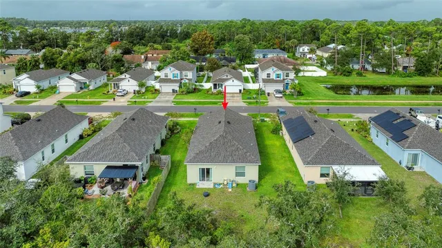 an aerial view of a house with a garden