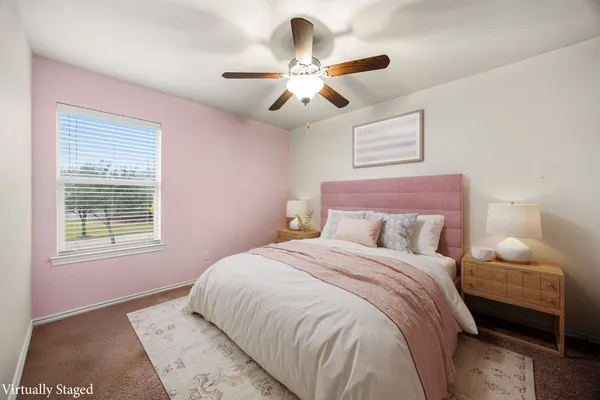 a bedroom with a large bed and a window