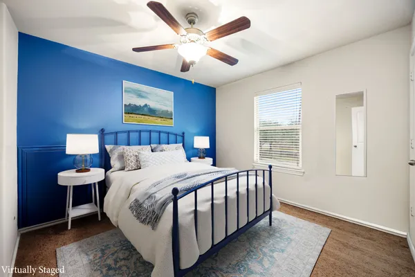 a bedroom with a bed and a window