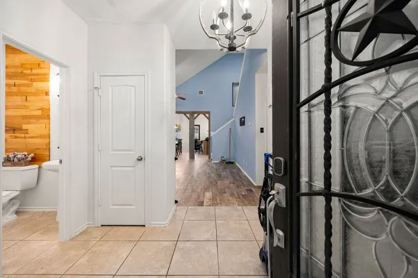 a view of an entryway with a chandelier