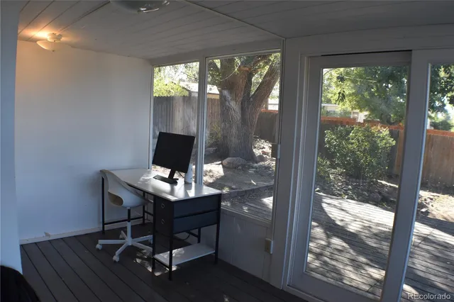 a living room with a window and outdoor view