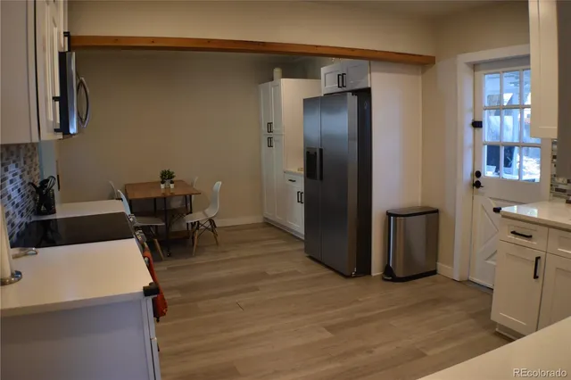 a view of a kitchen from the dinning room