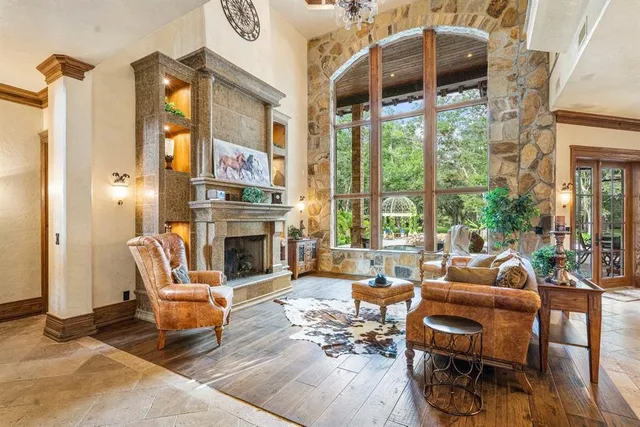 a building outdoor space with patio furniture and a fireplace