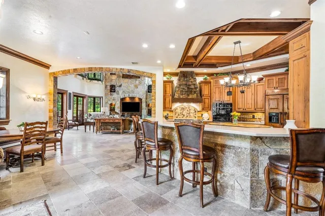 a dining hall with lots of tables and chairs