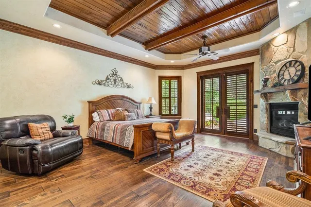 a bedroom with furniture and a fireplace