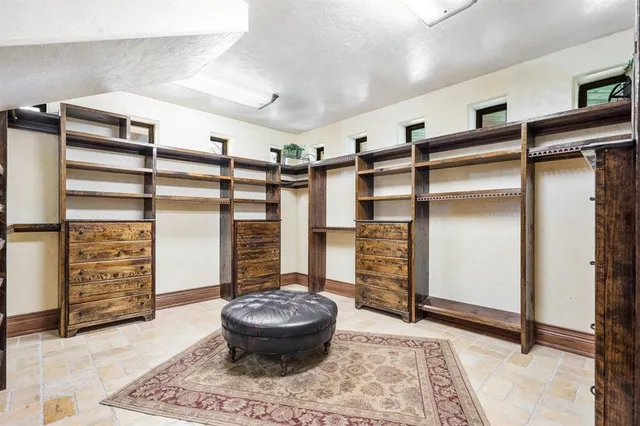 a living room with a walk in closet and a couch