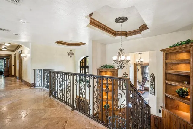 a view of a hallway with a chandelier