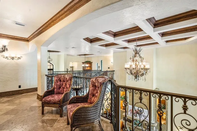 a view of a livingroom with furniture and a chandelier