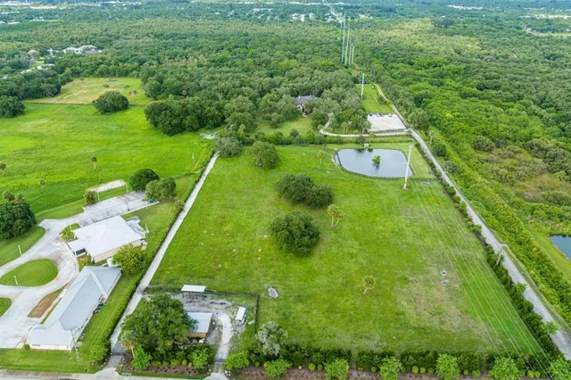 swimming pool view with a seating space