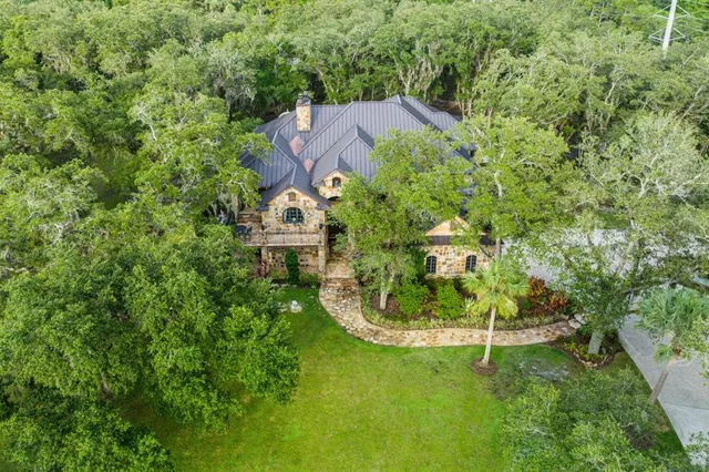 an aerial view of a house with a garden