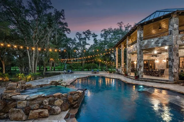 a view of a swimming pool with a patio