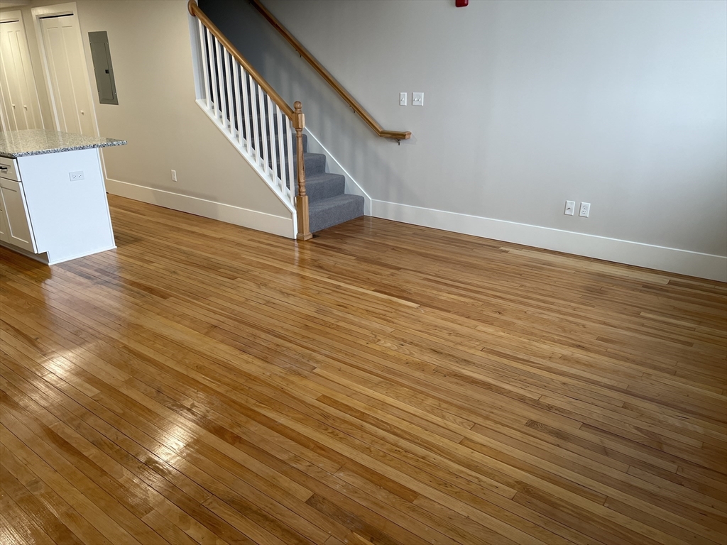 wooden floor in a hall with wooden floor