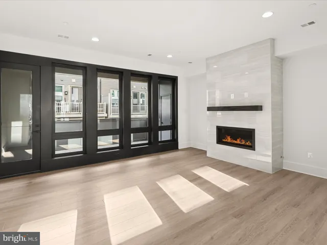 a kitchen with stainless steel appliances kitchen island a white counter space a sink and cabinets