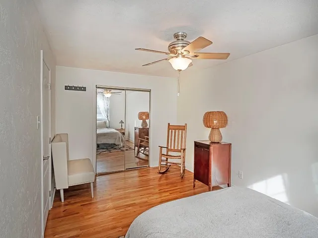 a bedroom with furniture and a chandelier