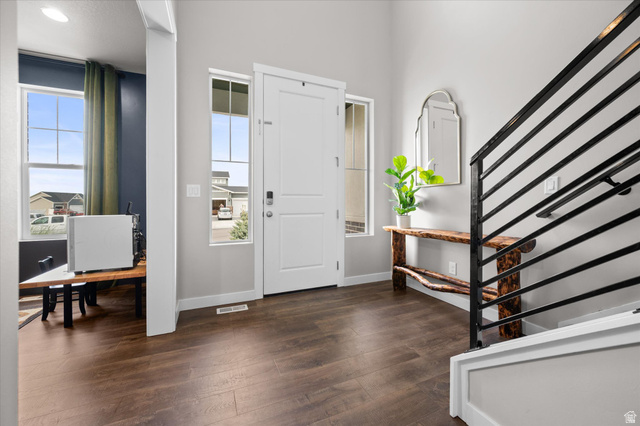 3359 Eurasian Crane Road Clinton, UT 84015 - Photo 18 of 71 Entryway featuring stairway and dark wood finished floors
