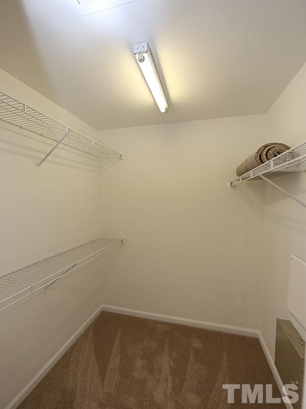 8519 Silhouette Place Raleigh, NC 27613 - Photo 13 of 19 a view of a room with racks on the wall