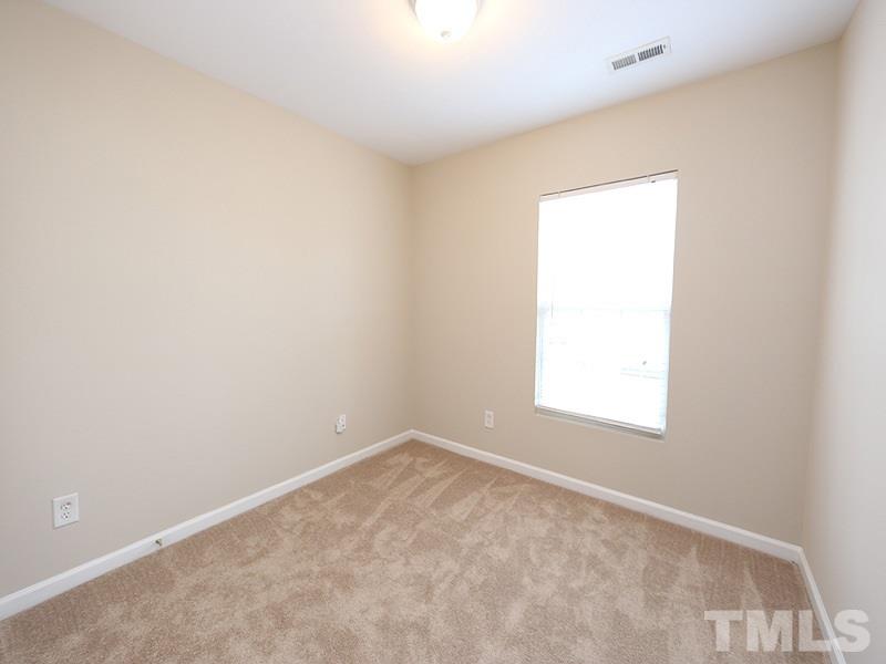 8519 Silhouette Place Raleigh, NC 27613 - Photo 15 of 19 an empty room with a window