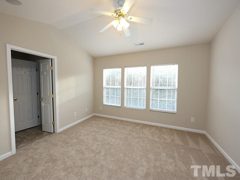 8519 Silhouette Place Raleigh, NC 27613 - Photo 9 of 19 a view of an empty room with a window