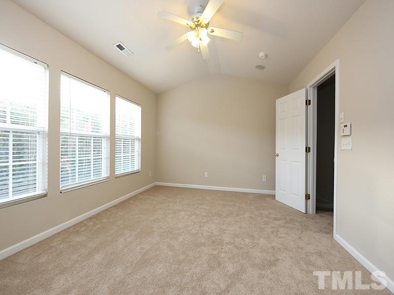 8519 Silhouette Place Raleigh, NC 27613 - Photo 10 of 19 a view of an empty room with a window