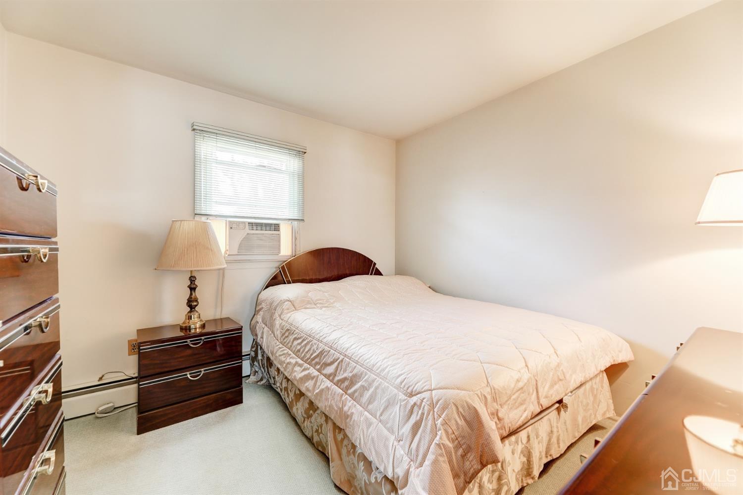 29 Ventnor Drive Edison, NJ 08820 - Photo 16 of 20 a bedroom with a bed and a window