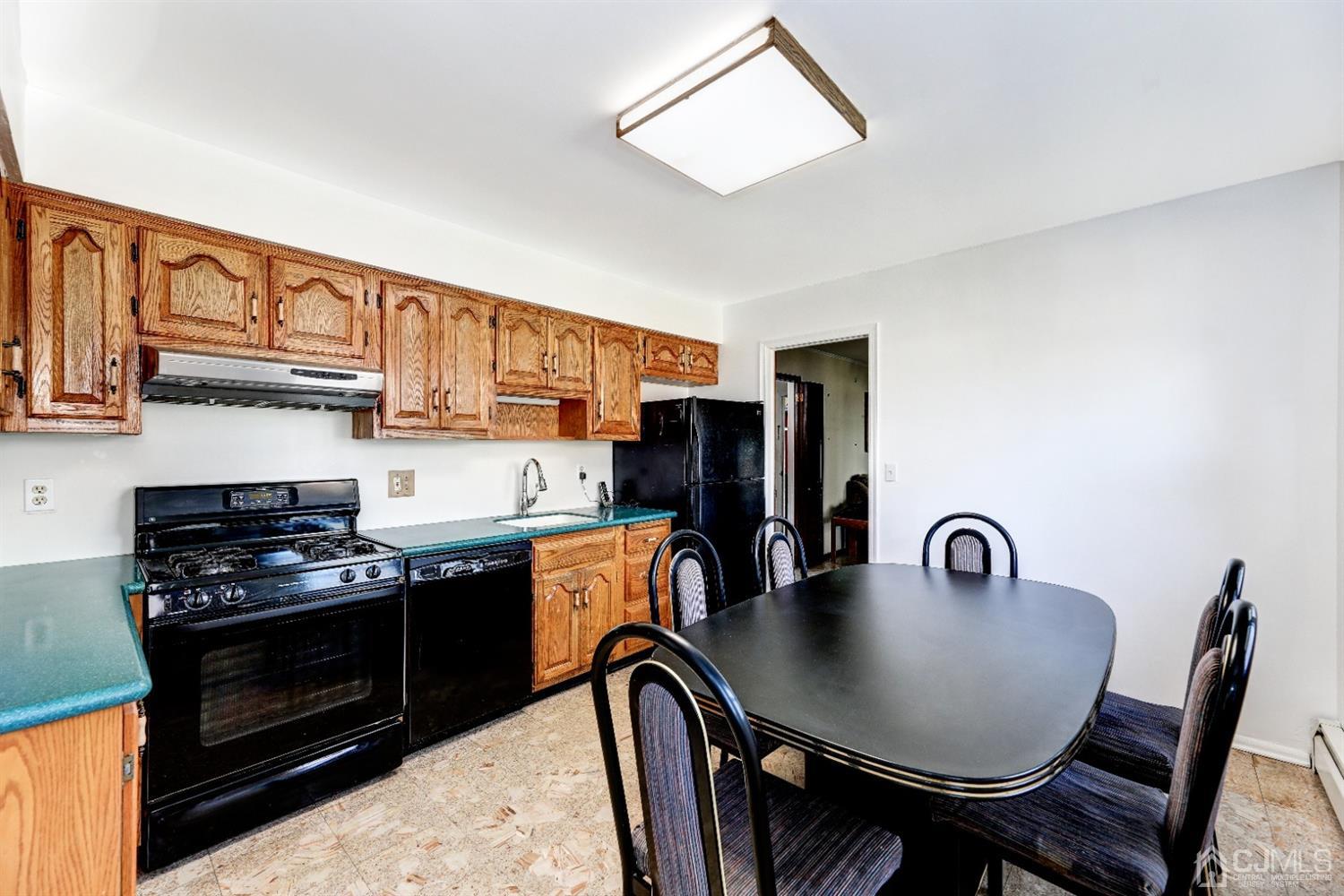 29 Ventnor Drive Edison, NJ 08820 - Photo 6 of 20 a kitchen with stainless steel appliances granite countertop a stove a sink dishwasher and cabinets with wooden floor