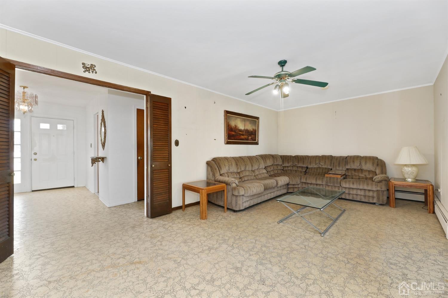 29 Ventnor Drive Edison, NJ 08820 - Photo 9 of 20 a living room with furniture and a ceiling fan