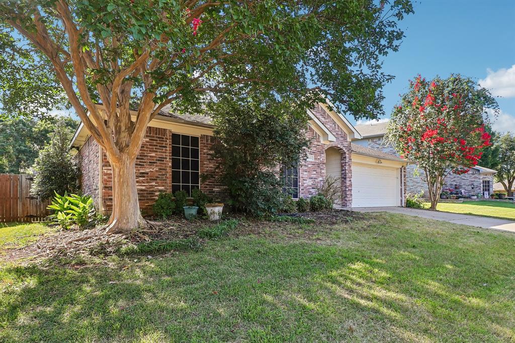 5609 Saddleback Road Arlington, TX 76017 - Photo 1 of 23 front view of a house with a yard