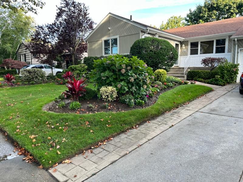 116 Strathmore Street Valley Stream, NY 11581 - Photo 1 of 1 View of home's exterior with a lawn