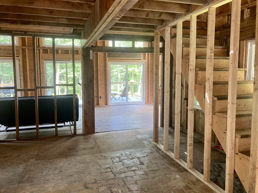 1621 Peru Road Windsor, MA 01270 - Photo 13 of 28 a view of an empty room with wooden floor and windows