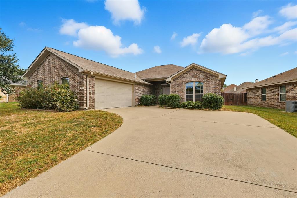 2512 Guinn Farms Road Tyler, TX 75707 - Photo 1 of 29 a front view of a house with a yard
