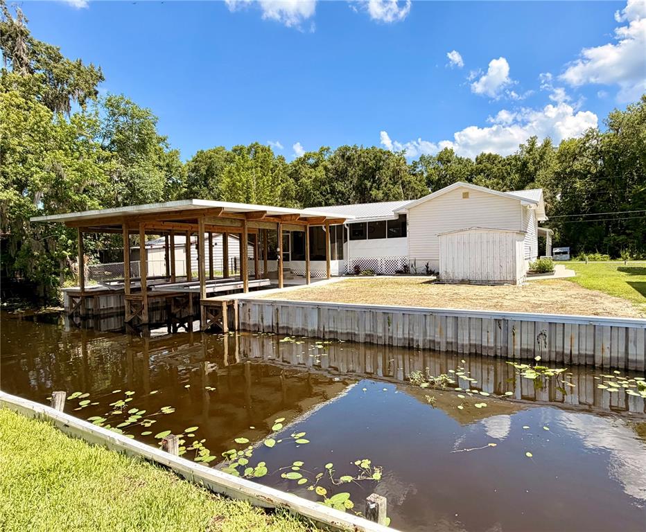 24521 Alligator Road Astor, FL 32102 - Photo 47 of 51 a view of a swimming pool with a patio