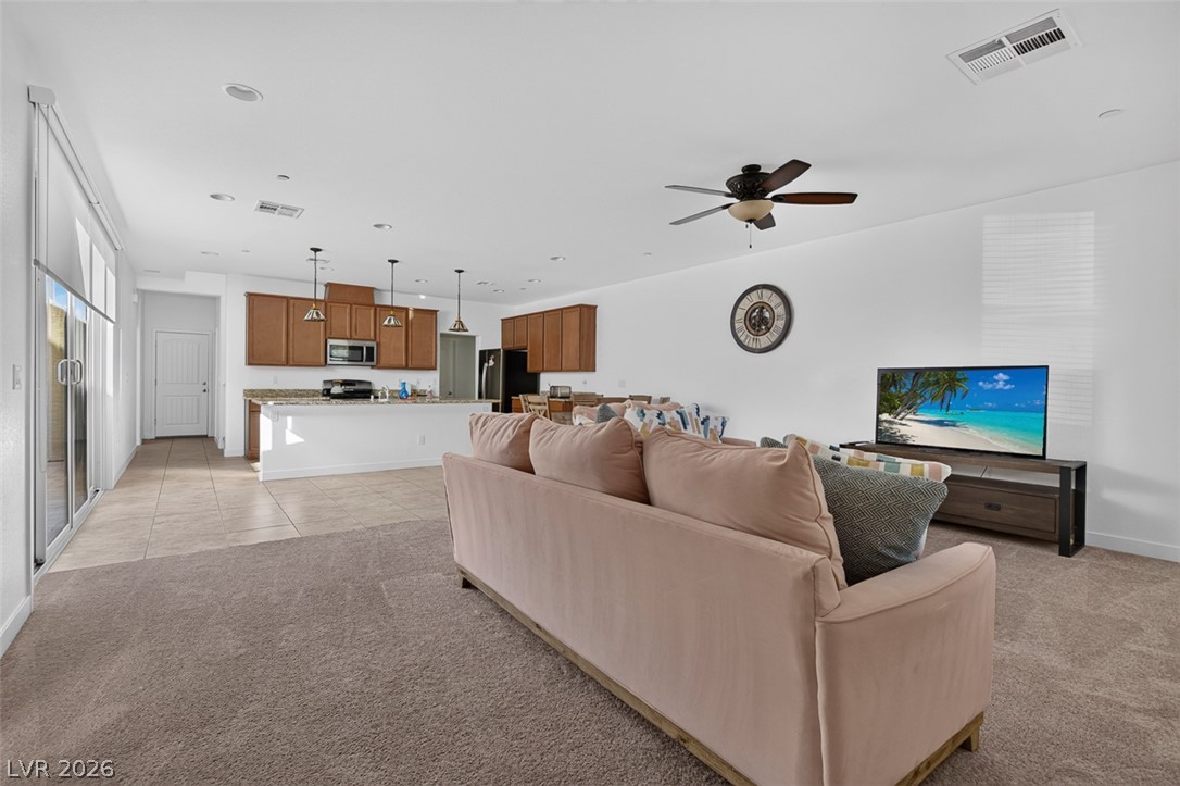 1100 East Sunset Road Henderson, NV 89011 - Photo 58 of 58 An open floorplan seamlessly connects the inviting living space to a well-appointed kitchen.