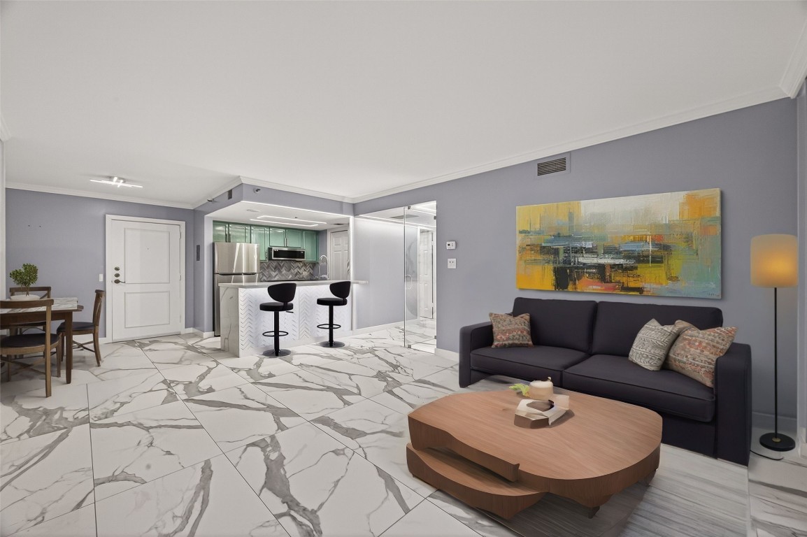 a living room with furniture and a breakfast area