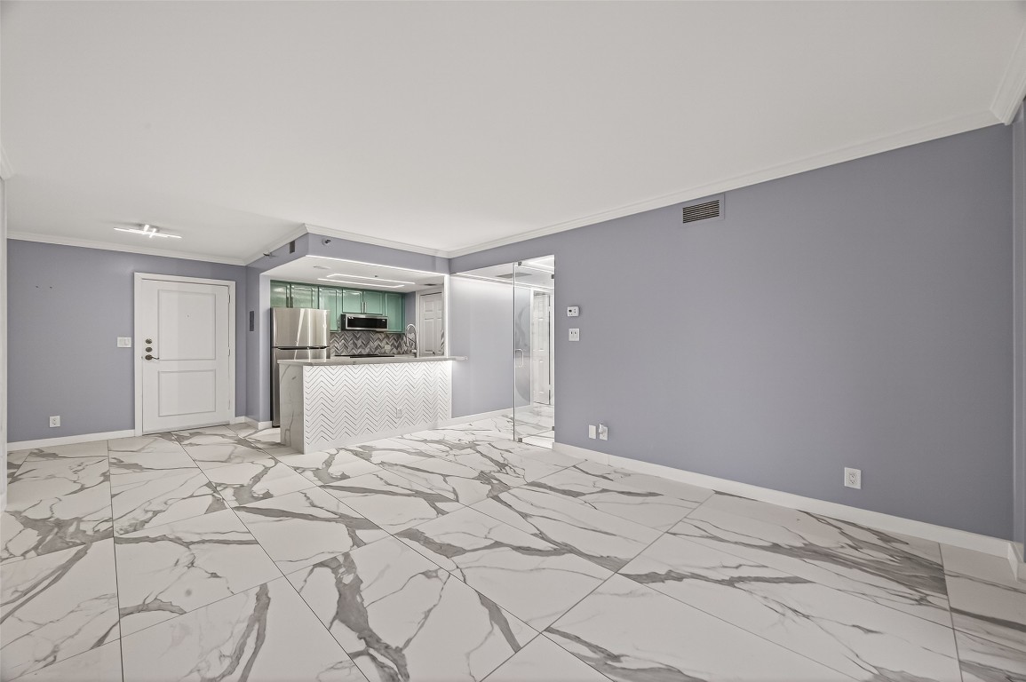 3525 Sage Road, Unit 1305 Houston, TX 77056 - Photo 2 of 30 a view of a bedroom with a bed and cabinets