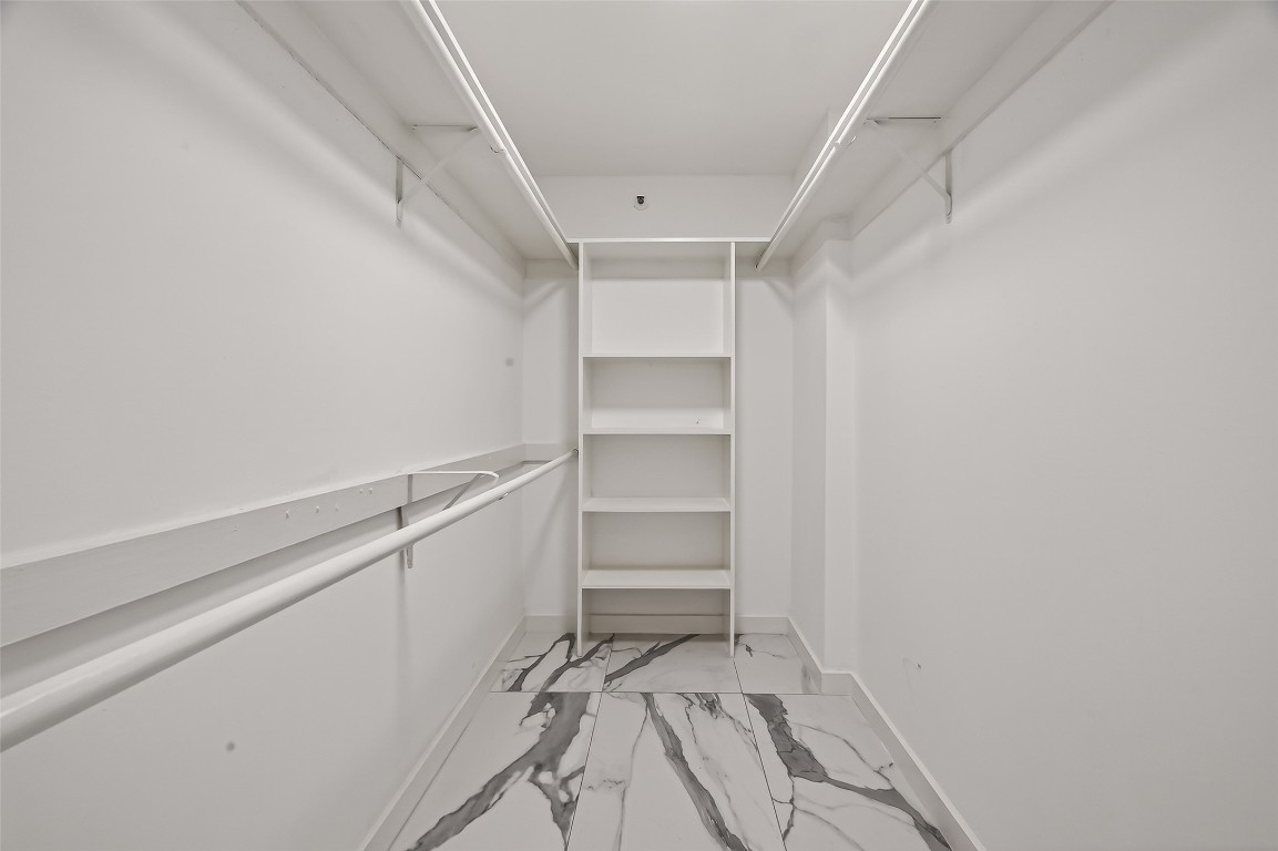 3525 Sage Road, Unit 1305 Houston, TX 77056 - Photo 27 of 30 a view of an empty walk in closet