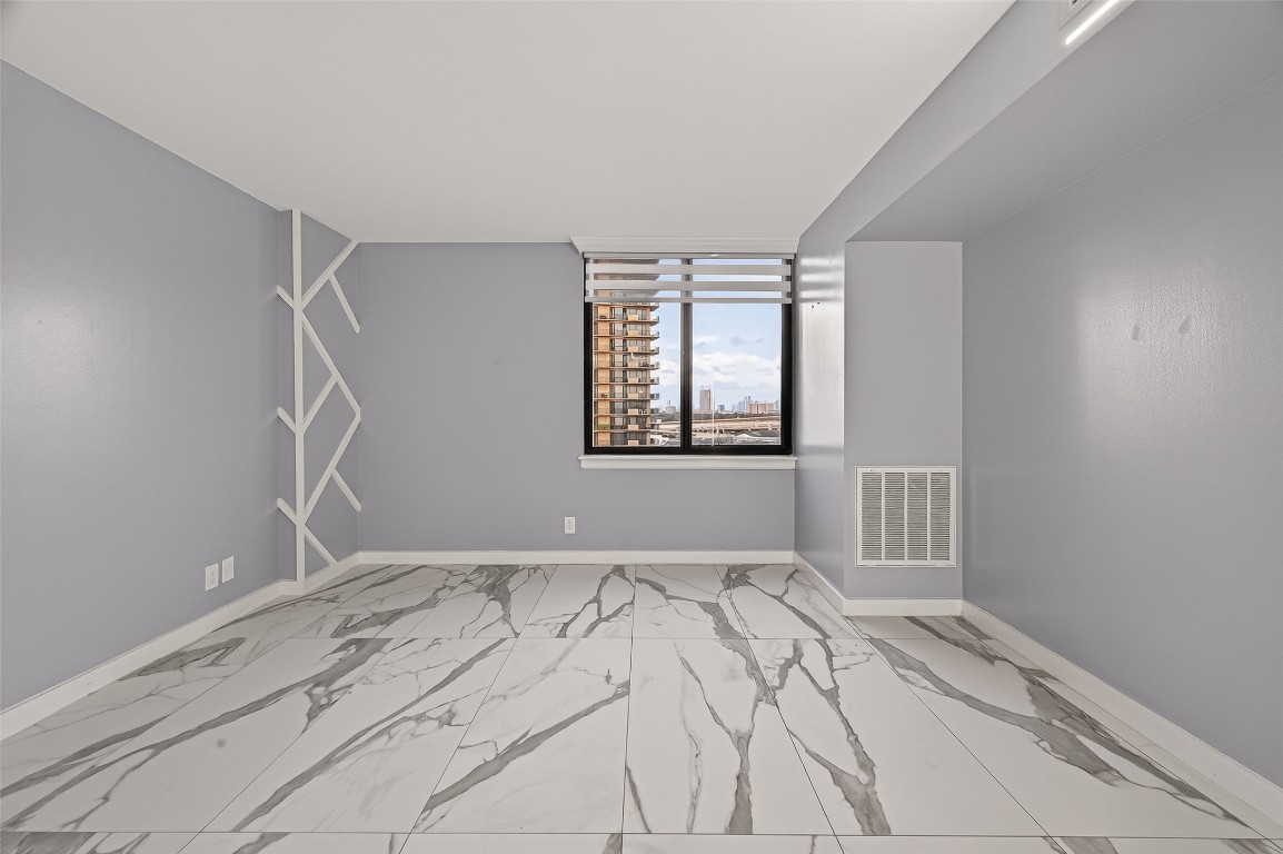 3525 Sage Road, Unit 1305 Houston, TX 77056 - Photo 4 of 30 a view of an empty room with a window