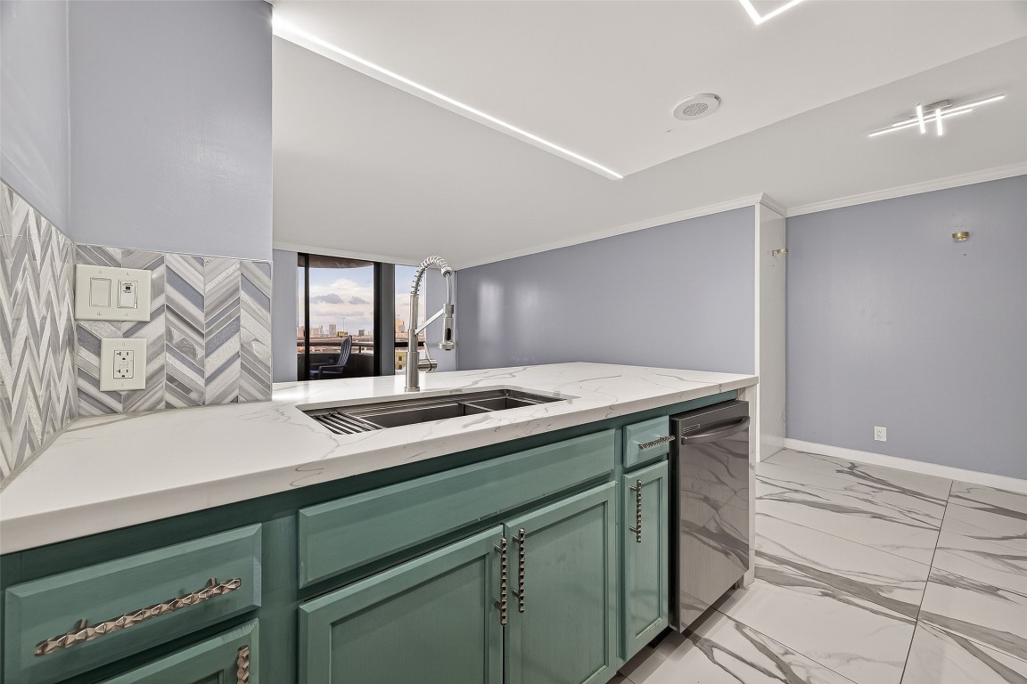 3525 Sage Road, Unit 1305 Houston, TX 77056 - Photo 9 of 30 a kitchen with a sink and cabinets