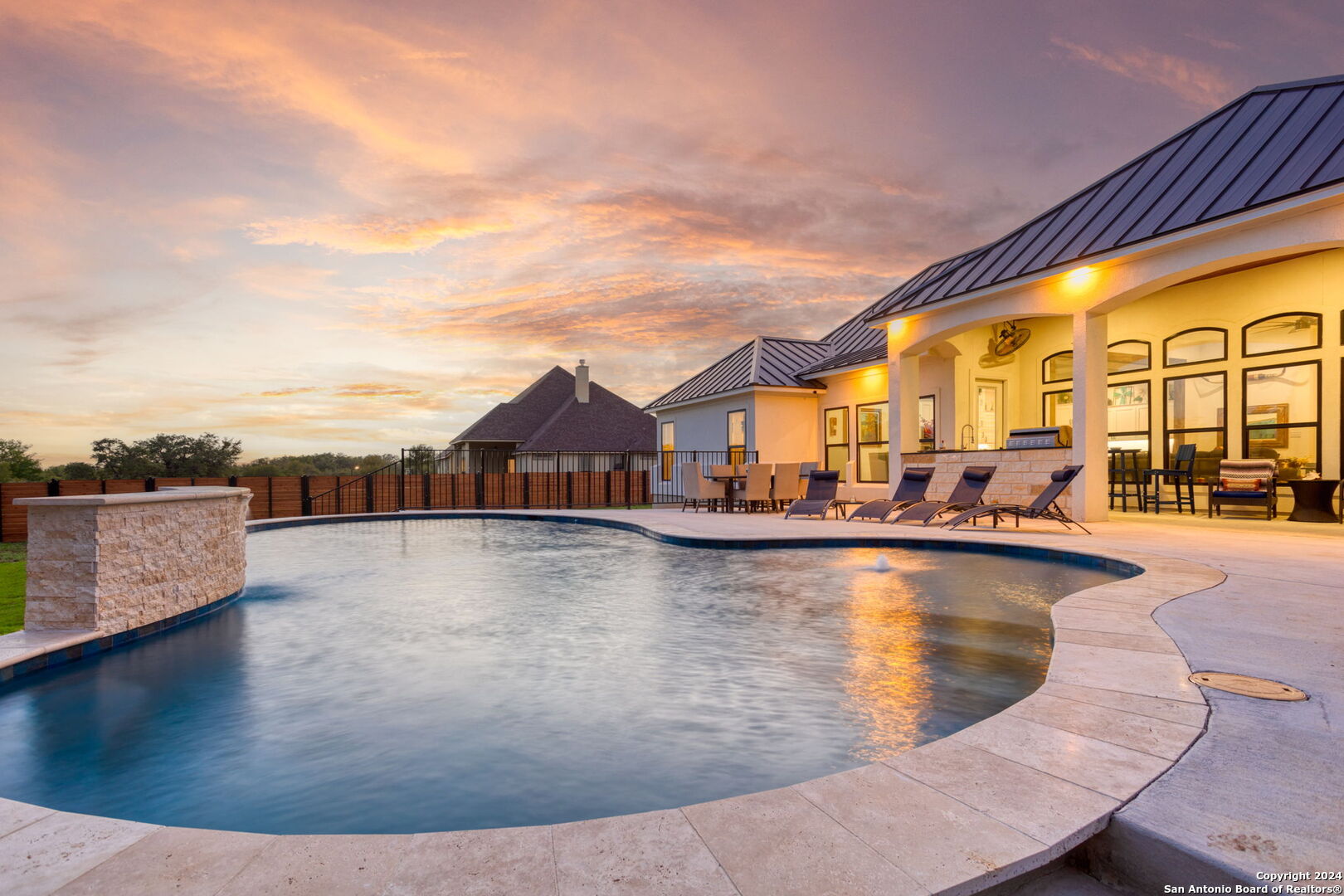 a view of a swimming pool with sitting area