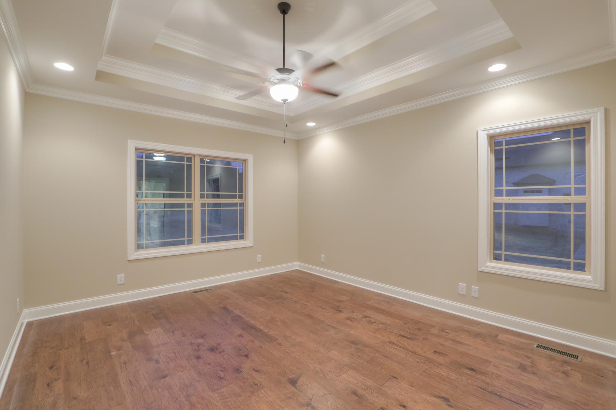 2231 Cairo Bend Road Lebanon, TN 37087 - Photo 14 of 29 a view of an empty room with a window and wooden floor