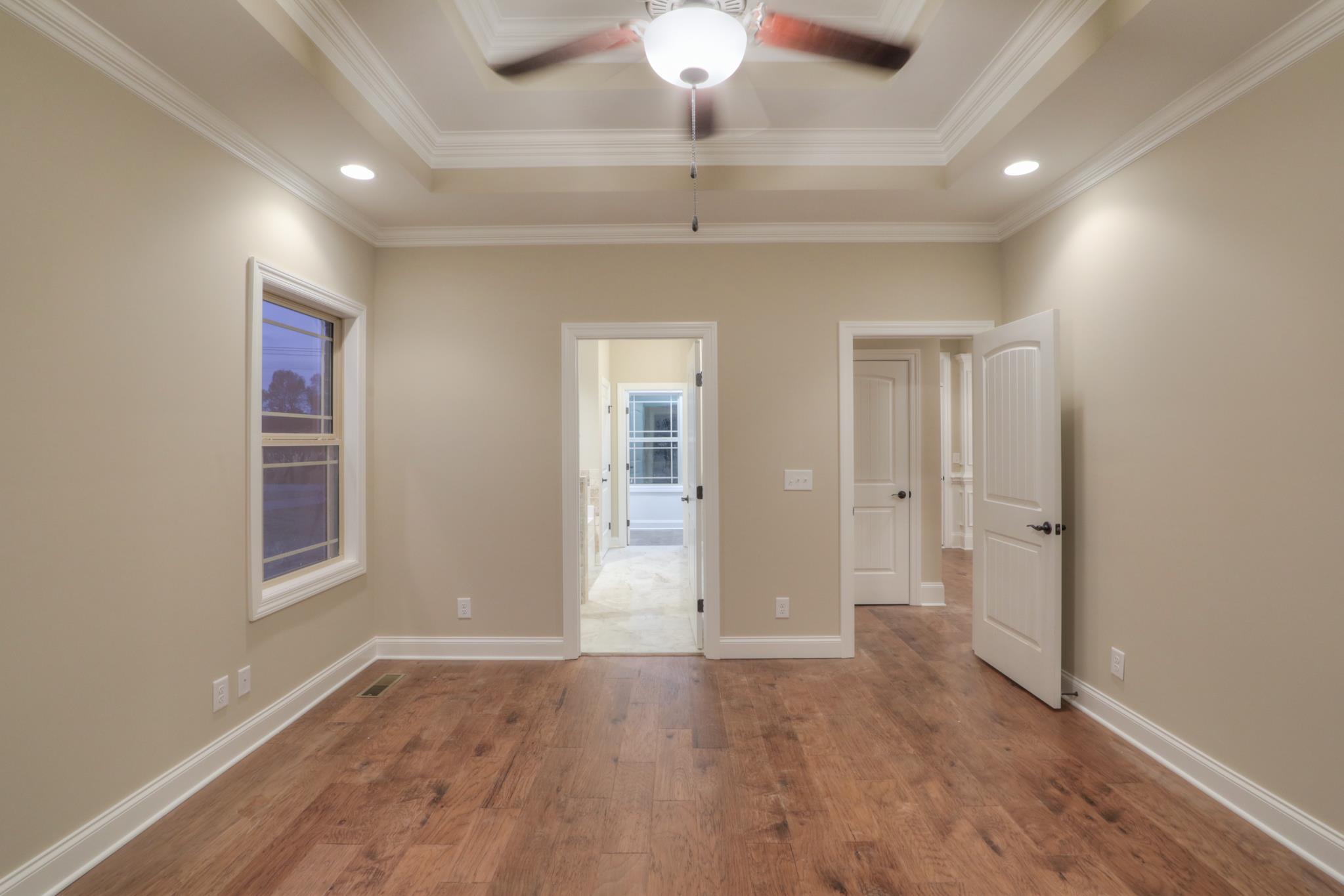 2231 Cairo Bend Road Lebanon, TN 37087 - Photo 15 of 29 wooden floor in an empty room with a window