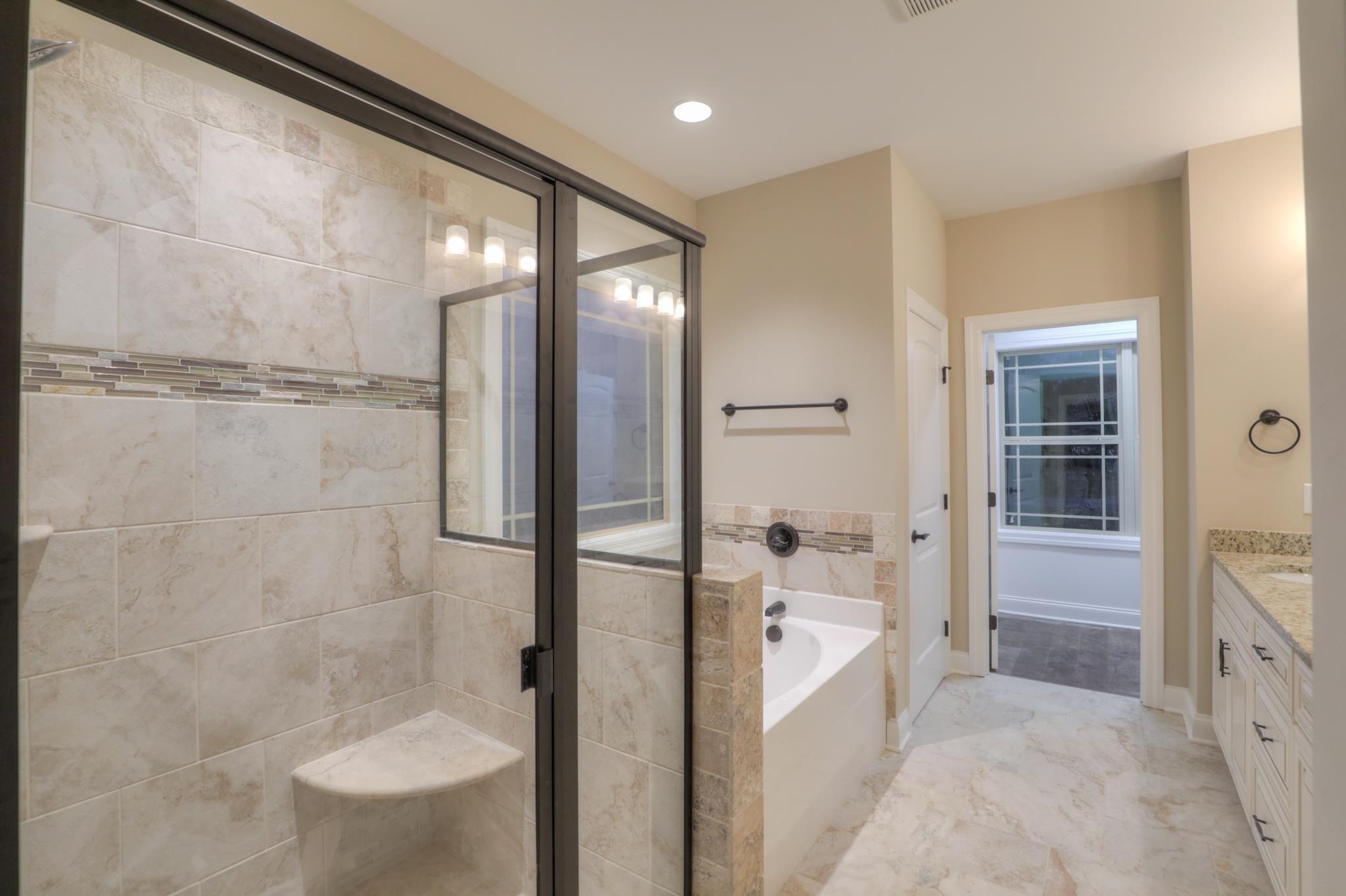 2231 Cairo Bend Road Lebanon, TN 37087 - Photo 16 of 29 a bathroom with a glass shower door