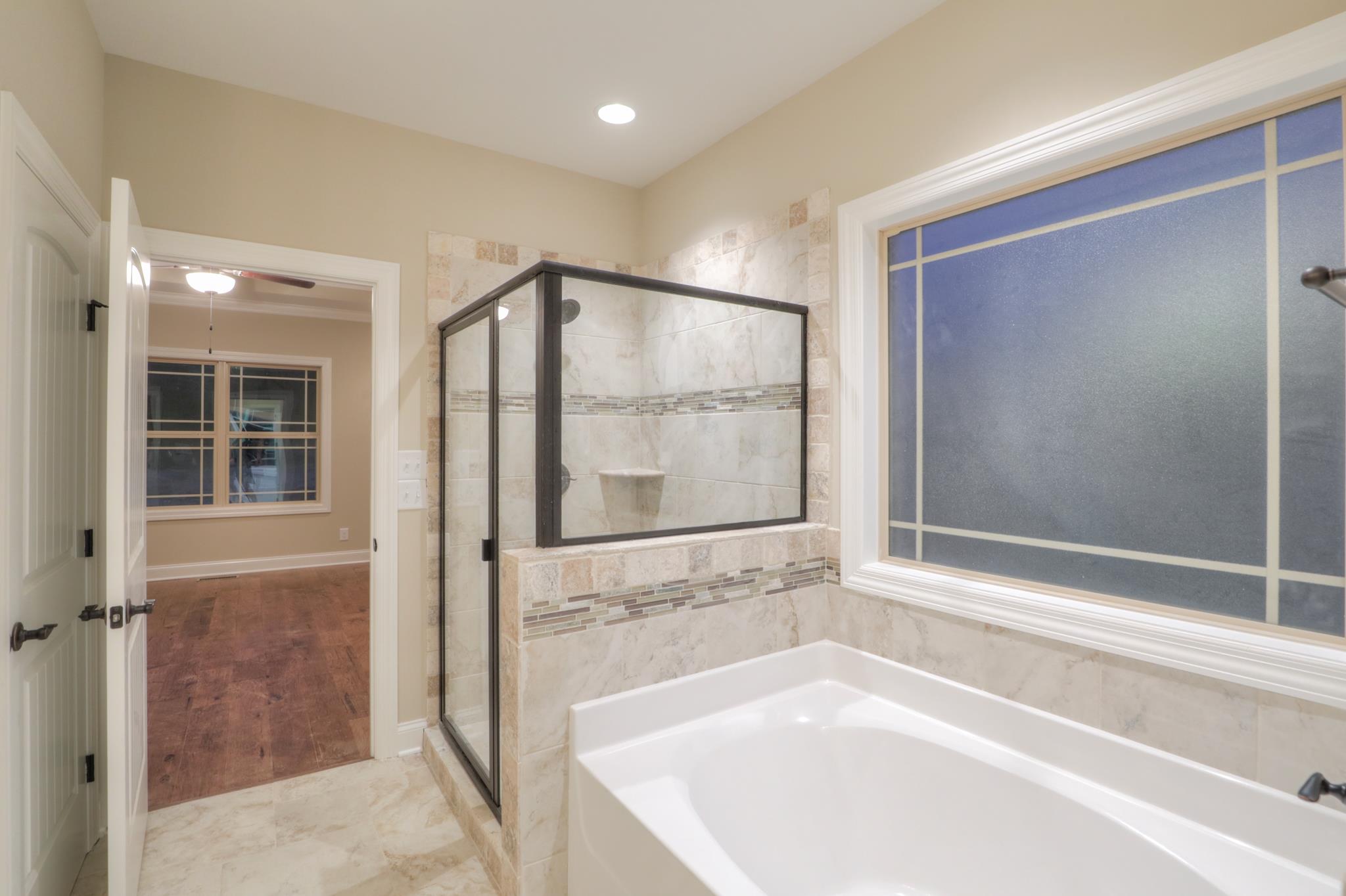 2231 Cairo Bend Road Lebanon, TN 37087 - Photo 18 of 29 a bathroom with a bathtub and a shower