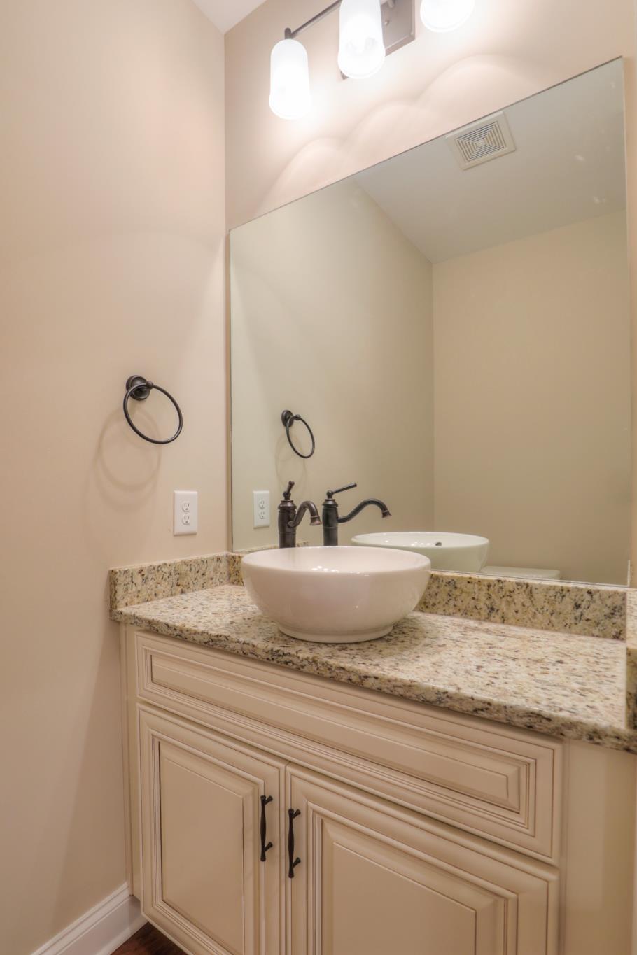 2231 Cairo Bend Road Lebanon, TN 37087 - Photo 21 of 29 a bathroom with a granite countertop sink and mirror