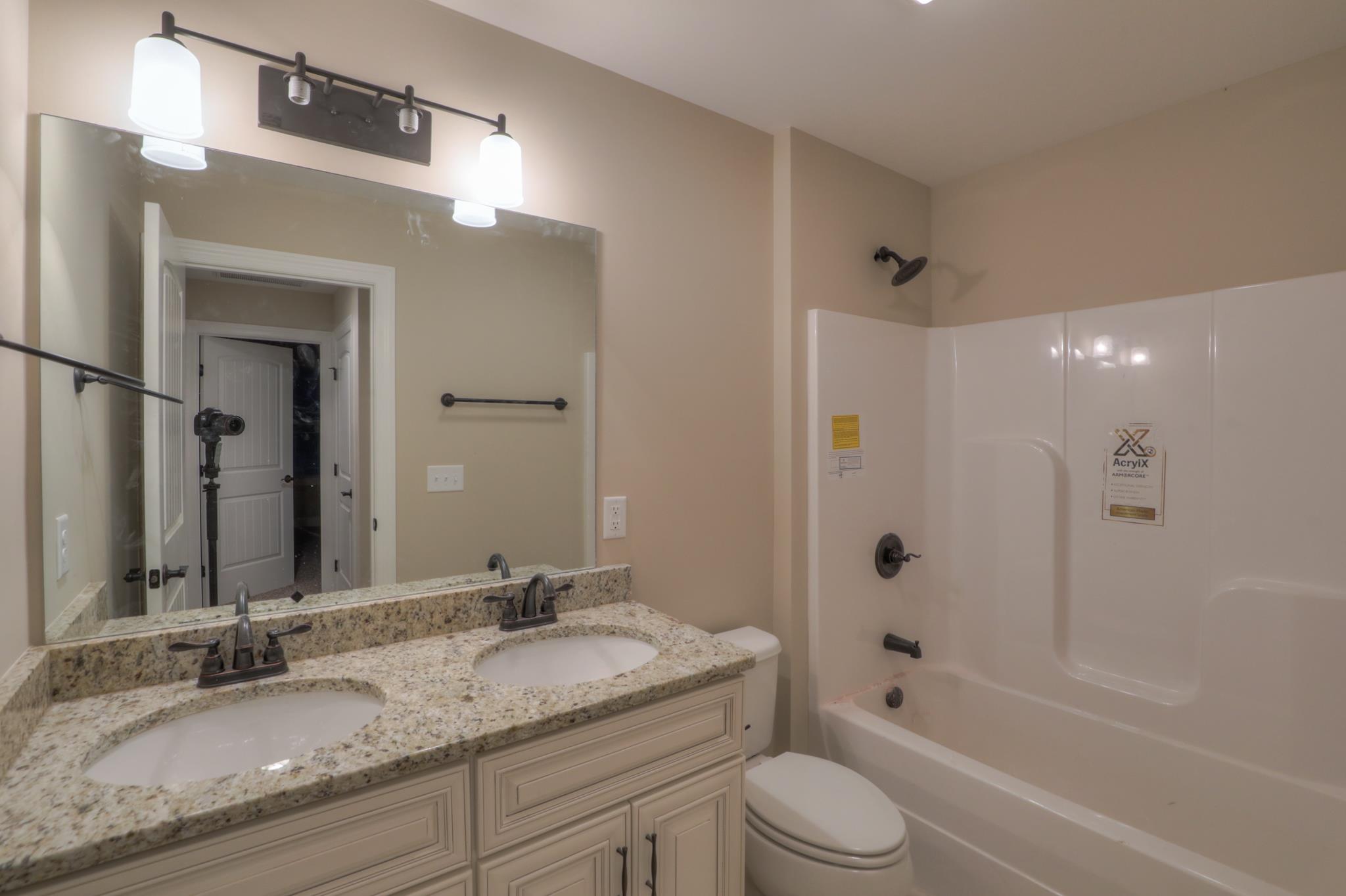 2231 Cairo Bend Road Lebanon, TN 37087 - Photo 24 of 29 a bathroom with a granite countertop sink toilet and shower