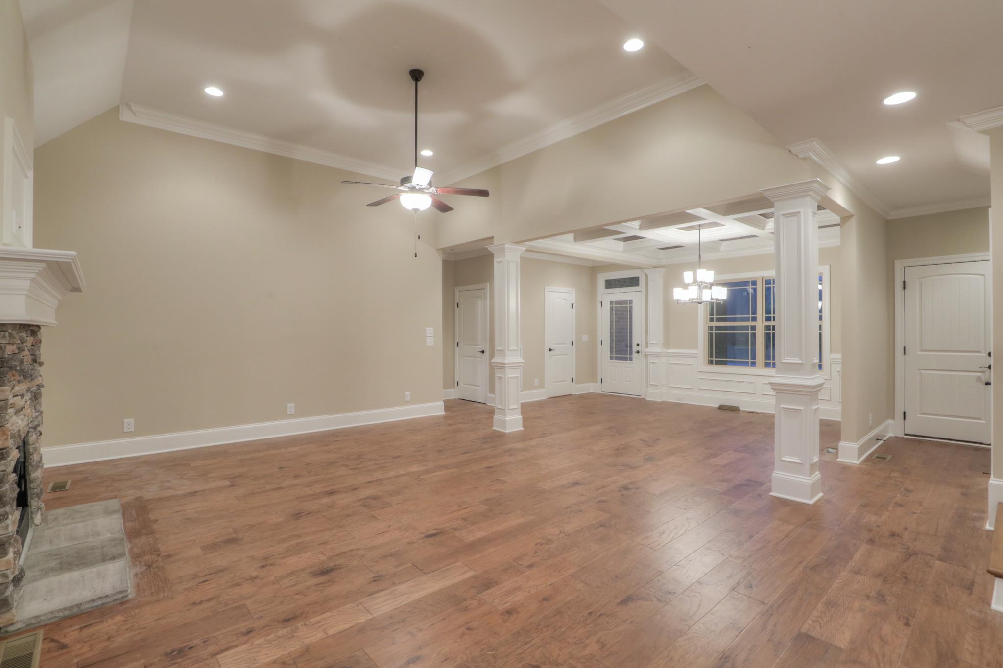 2231 Cairo Bend Road Lebanon, TN 37087 - Photo 8 of 29 an empty room with wooden floor and windows