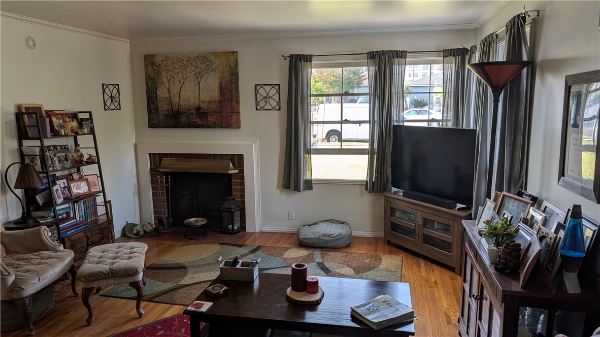 3762 Mohawk Street Pasadena, CA 91107 - Photo 5 of 20 a living room with furniture a flat screen tv and a fireplace