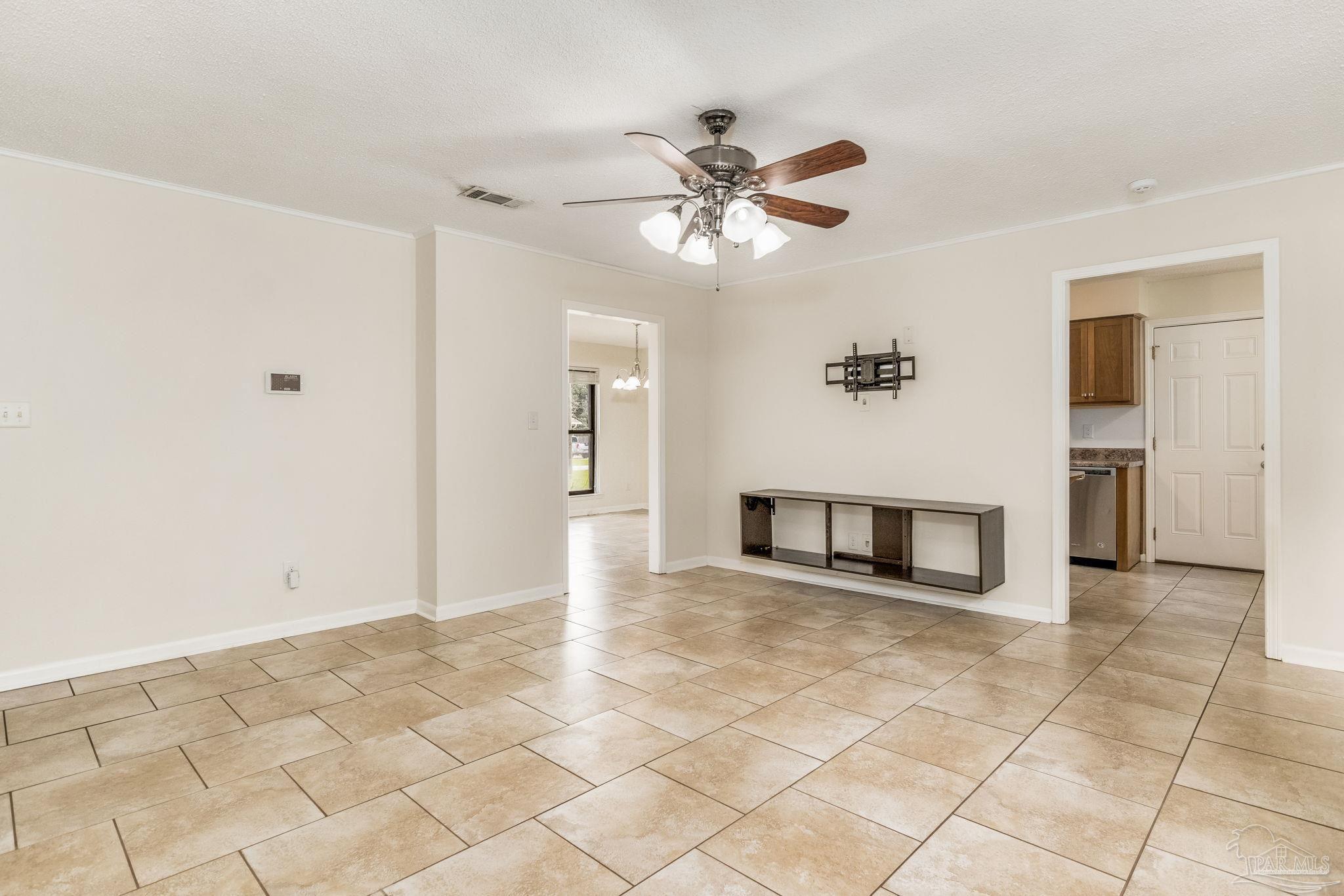 1422 Starlight Drive Cantonment, FL 32533 - Photo 13 of 49 a view of a livingroom with a ceiling fan