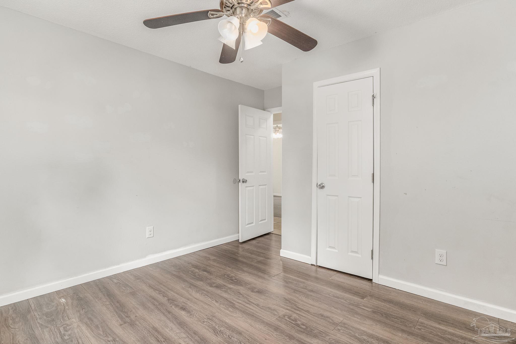 1422 Starlight Drive Cantonment, FL 32533 - Photo 21 of 49 wooden floor in an empty room