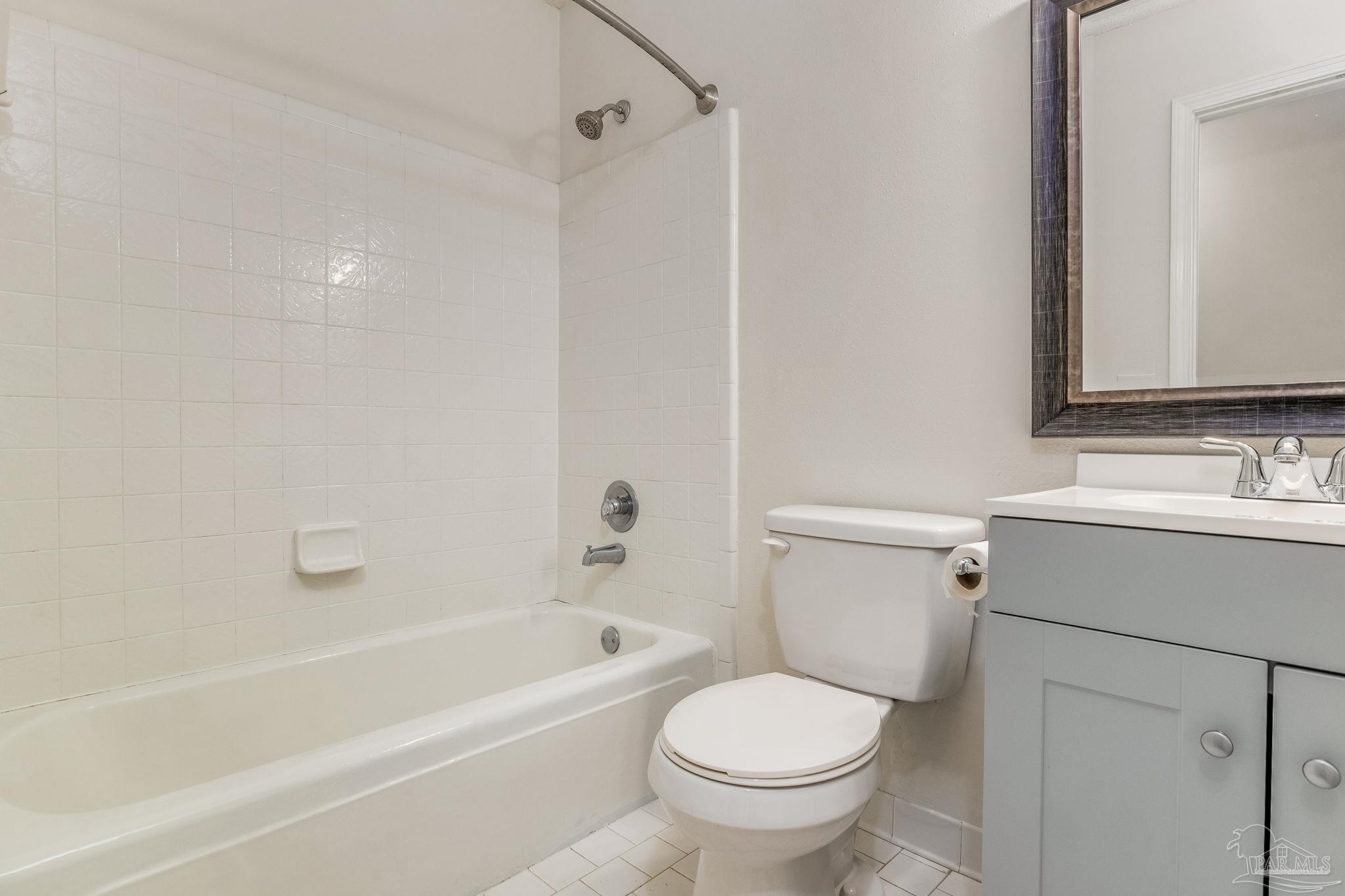 1422 Starlight Drive Cantonment, FL 32533 - Photo 24 of 49 a bathroom with a sink toilet and bathtub